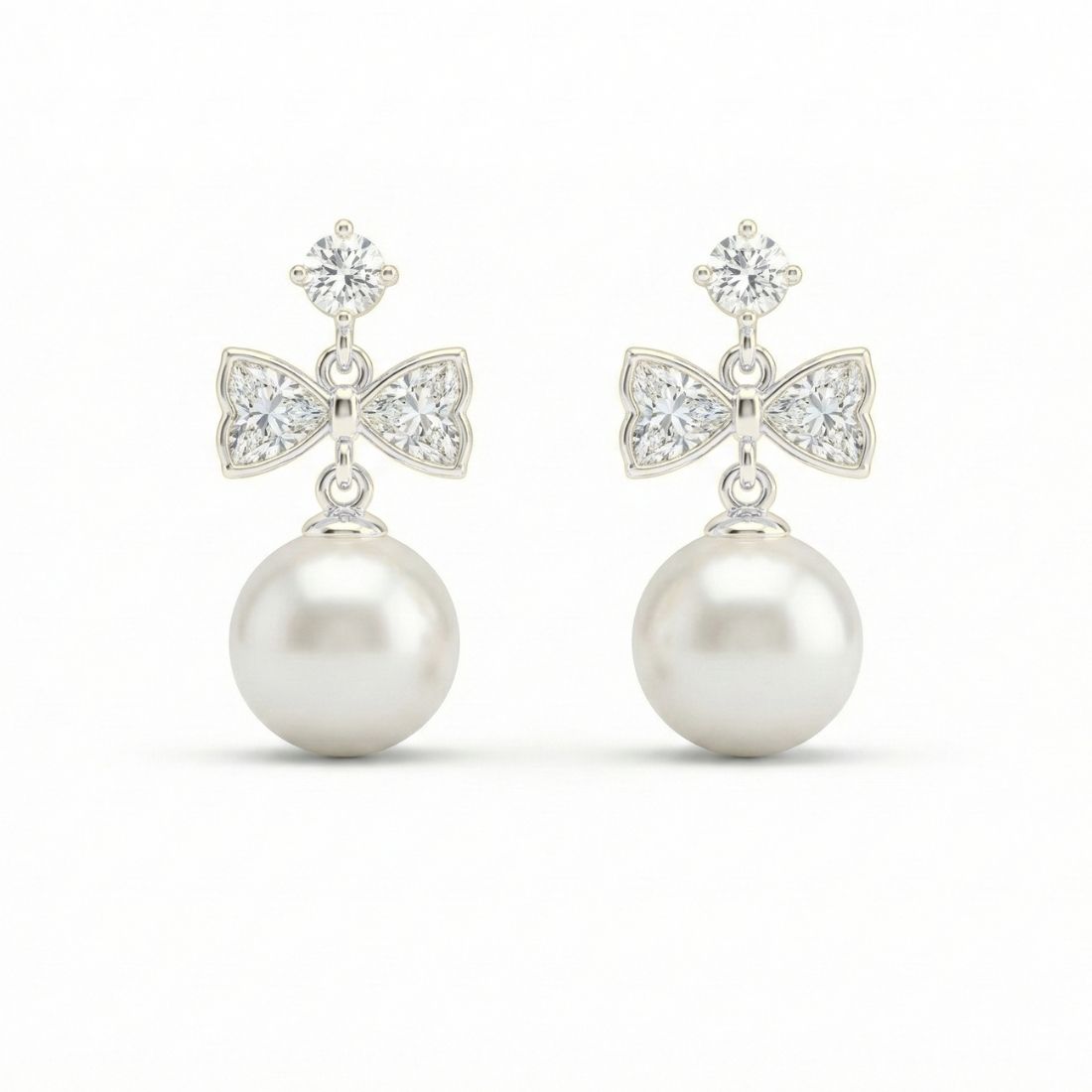 Silver Tone Bow Pearl Drop Earrings